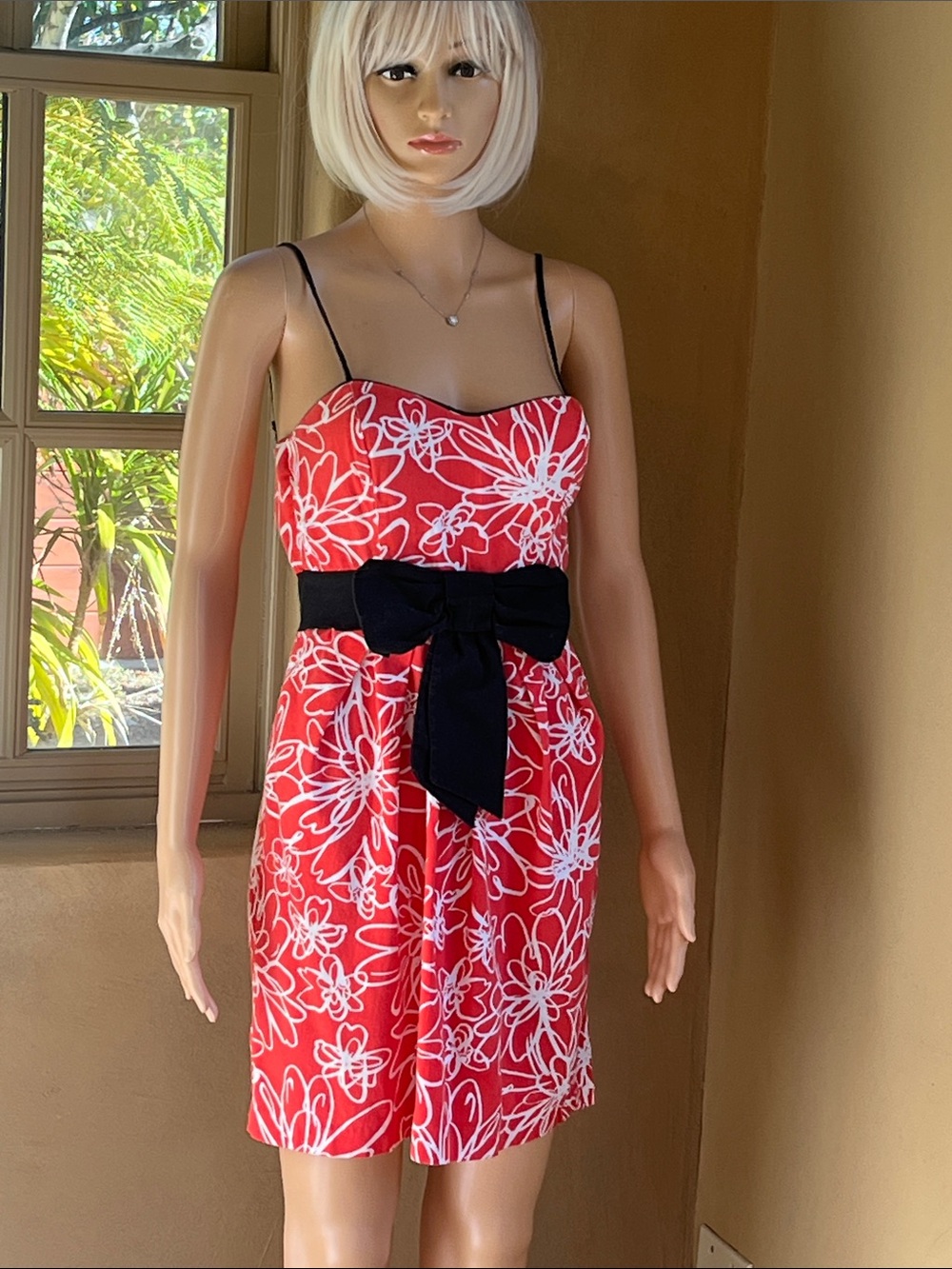 B. Smart dress with large black bow